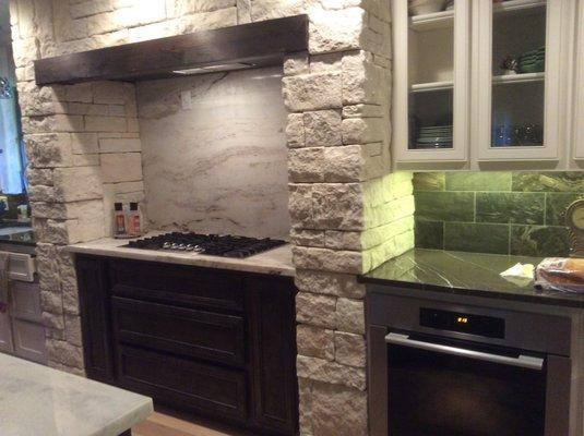 Project completed 2015.  1980s home, combined tiny kitchen and dining room to become open concept with marble, rock.