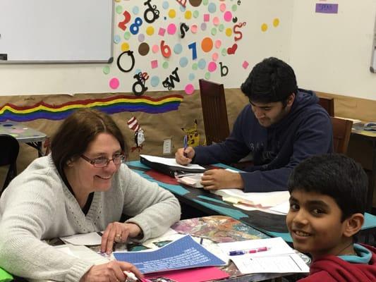 Ms.Stegall helping students with their essay assignments