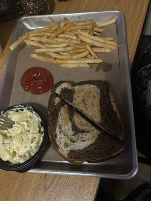 Rueben with fries and potato salad