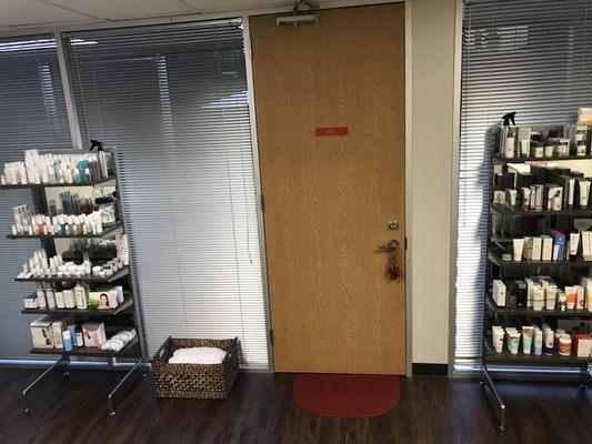 Inside the front door, Product shelving in the waiting area.