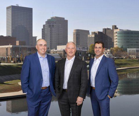 NRS Injury Law partners Dave Nager, Dan Romaine & Jerry Schneiberg with Dayton skyline image.   Visit our Dayton Office located in Fairborn.