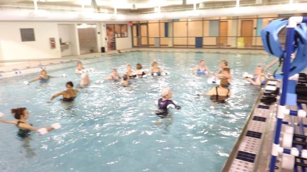 Silver Sneakers and senior aquatic class in warm water activity pool.