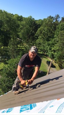 Filiberto installing a metal roof