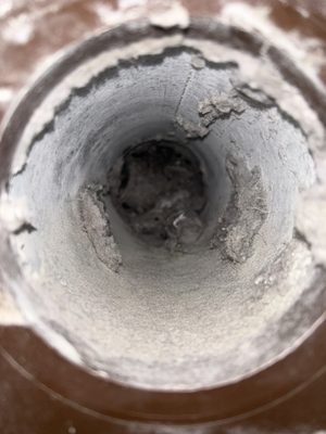 Clogged dryer vent preventing airflow from going through.