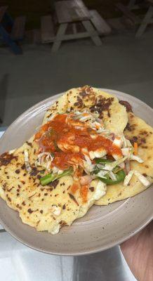 Pupusas with curtido and homemade tomato salsa.