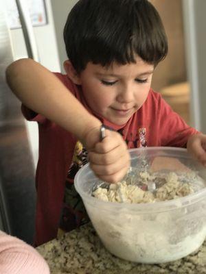 Helping make morning breakfast