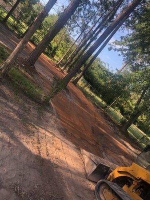 we filled a pond and graded out the back yard for proper drainage in a customers backyard.