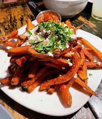 Papas Fritas: fries with garlic and cotija cheese