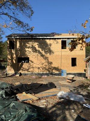 Finishing up sheeting onto the roof with underlayment drip edge and shingles !