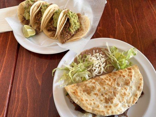 Carnitas tacos with guacamole, and lengua super quesadilla. Both delicious.