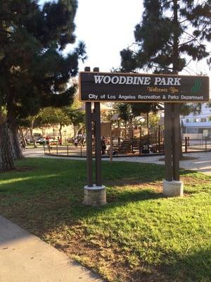 Front view of park with picnic table area in the far back