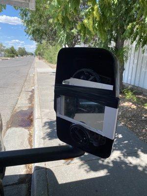 2 broken rear view mirrors