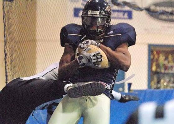 Wide receiver Marcus Lewis goes up high for a touchdown catch.