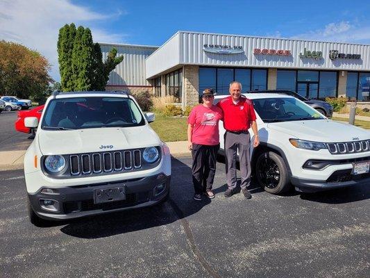 Myself standing next to my old Jeep and Greg next to my new baby