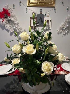 Beautiful lilies & white roses cascading through this gorgeous arrangement