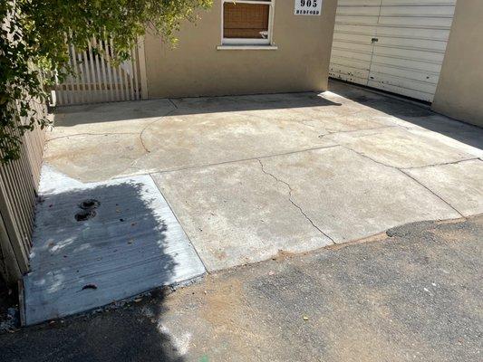 Nice clean concrete fix in the back corner of our property after a sewer pipe replacement.