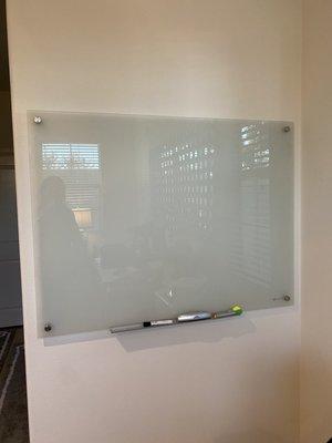 Dry wall fix and painting the wall plus mounting of a heavy glass white board. The office wall is fixed!