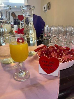 glasses set out with pretty pink napkins for decor.