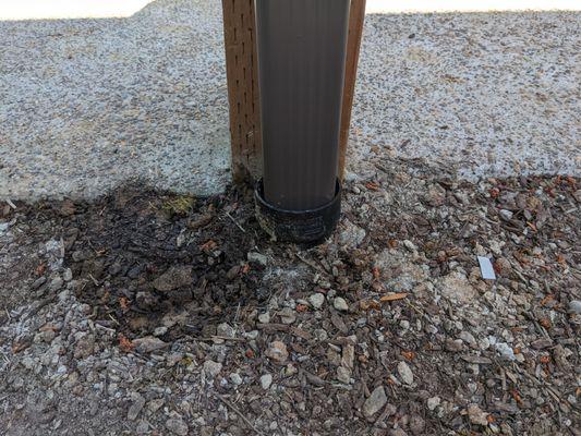 Downspout termination to PVC outflow.