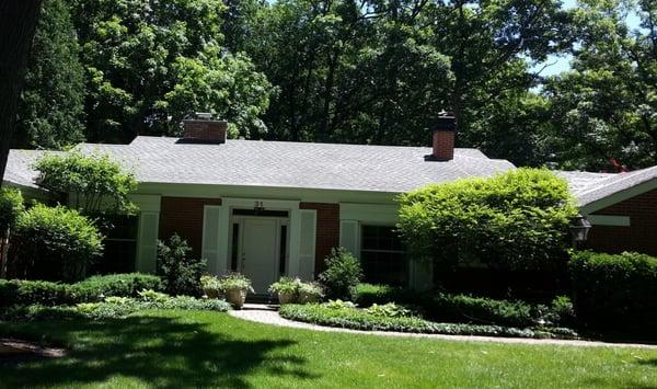 After photo of a brilliant white asphalt shingled roof.