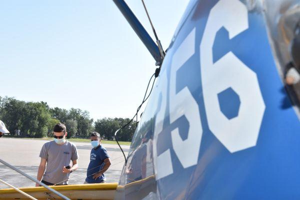 Mask on!  Pre-flighting the Stearman.