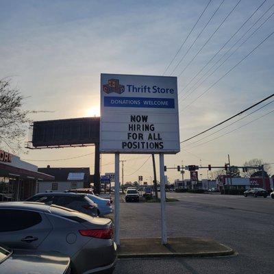 Store sign asking for workers.