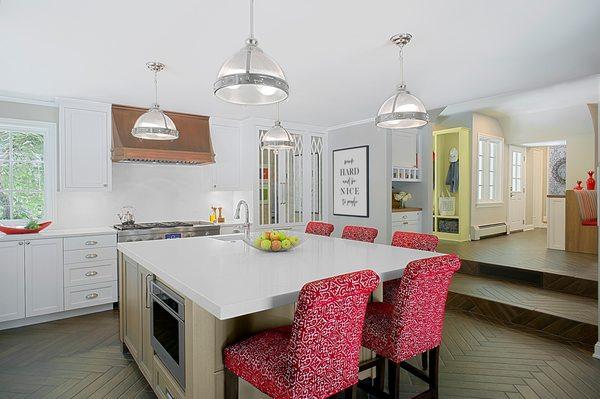 A custom white modern Tudor kitchen inspired by the historic architecture of the home and clients' transitional style.