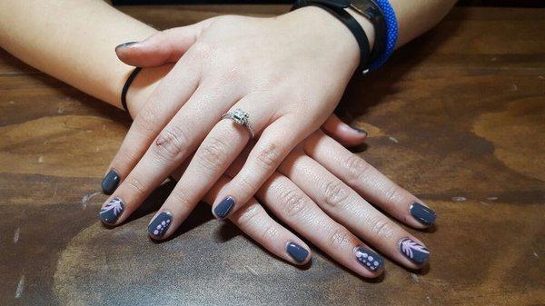 Dark gray gel with pink nail art.