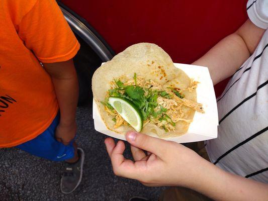 Chicken taco from the food truck. This was salty. My child asked for no onions no salsa, which is why it's bare.