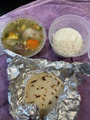 Soup comes with rice and a tortilla