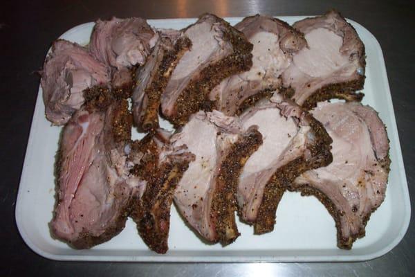 Pork loin roast, (bone in) cooked and sliced