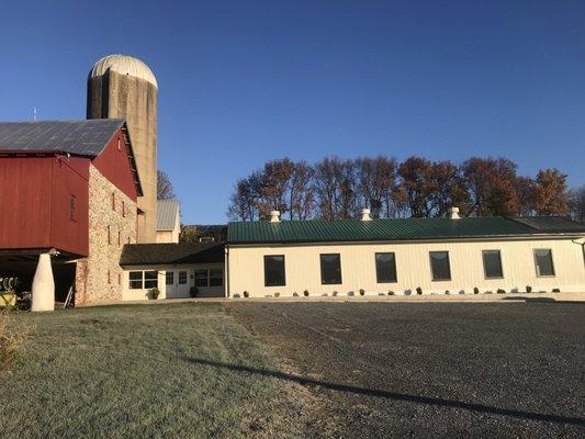 Masthof Bookstore and Press building next to barn.