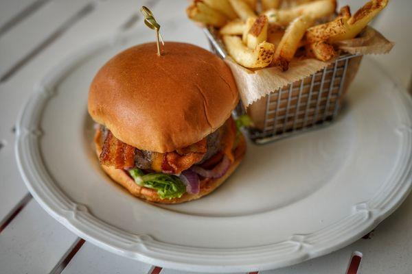 The Grill Burger - 1/2lb Tri-blend burger (chuck, brisket, short rib), lettuce, tomato, onion, cheddar cheese, hickory bacon, brioche bun