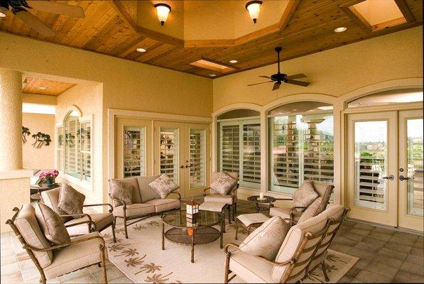 White hinged wood shutters in living space