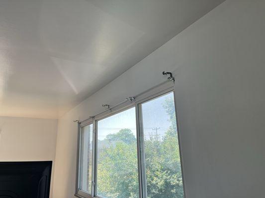 Family room walls and ceiling over patio doors painted white