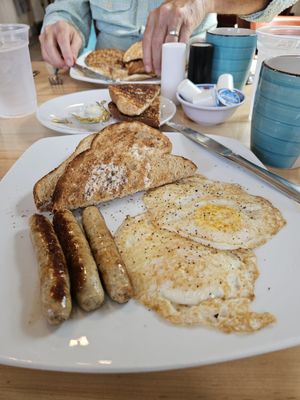 A delicious egg and sausage breakfast.