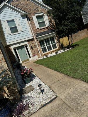 flower bed remodel(installed rocks, lights, flowers)