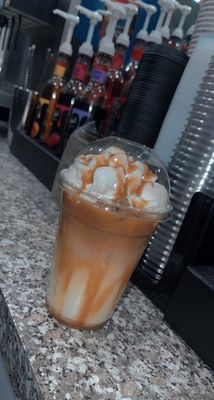 Iced mocha with caramel drizzle and whipped cream