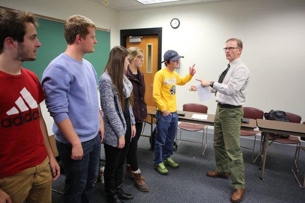 Students engage with Mark R. Davies, Professor of Education & Coordinator of Environment, Sustainability & Society at Hartwick College.