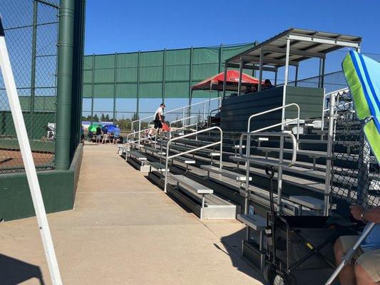 Good sized stands with a covered press box.  There are power outlets to charge our devices up there.