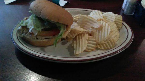 Grilled chicken sandwich with chips.