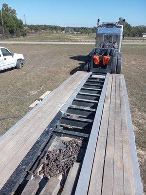 Before and after sandblasting on  a lowboy big rig trailer