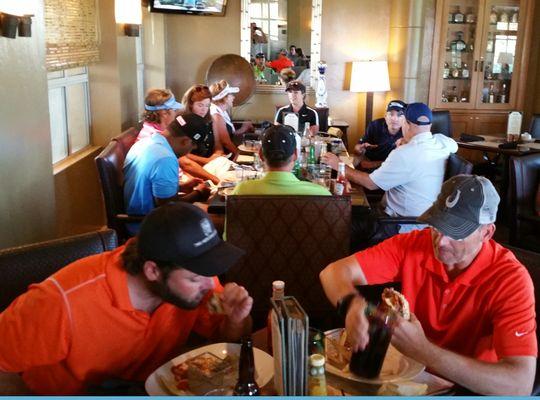 Golf and Grow members enjoying lunch at the Phoencian bar after the round. We always buy the first beer