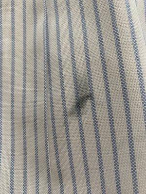 Black spot on back of another shirt that was cleaned by Dry Clean City