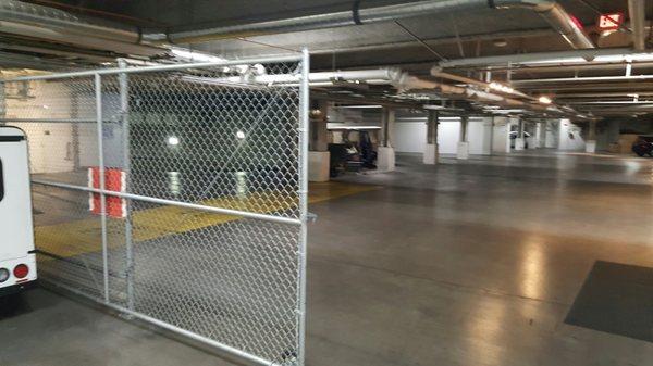 Chain link slide gate inside garage