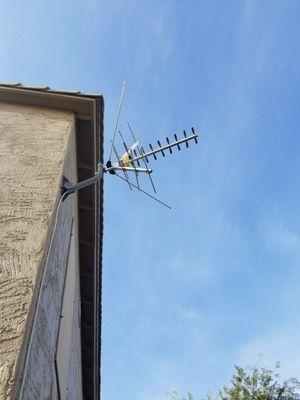 Very compact antenna, mounted securely, coax secured to the house.