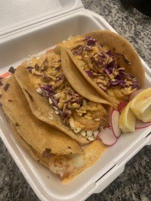 One queso shrimp taco and two regular shrimp tacos