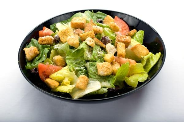 A delicious Caesar salad with croutons and tomatoes. The perfect meal from Genova's To Go.