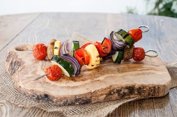 Vegetable Skewers: seasonal veggies grilled on an open flame, drizzled with fresh tahini dressing, served with flatbread