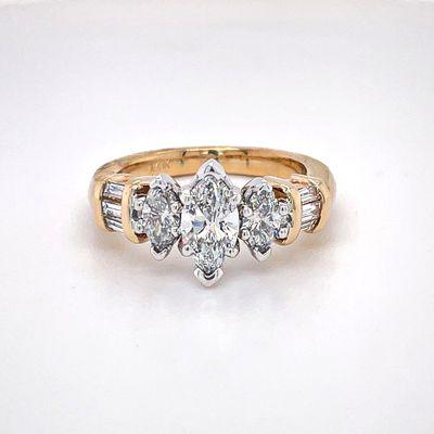 14K two toned ring with marquise, round and baguette diamonds